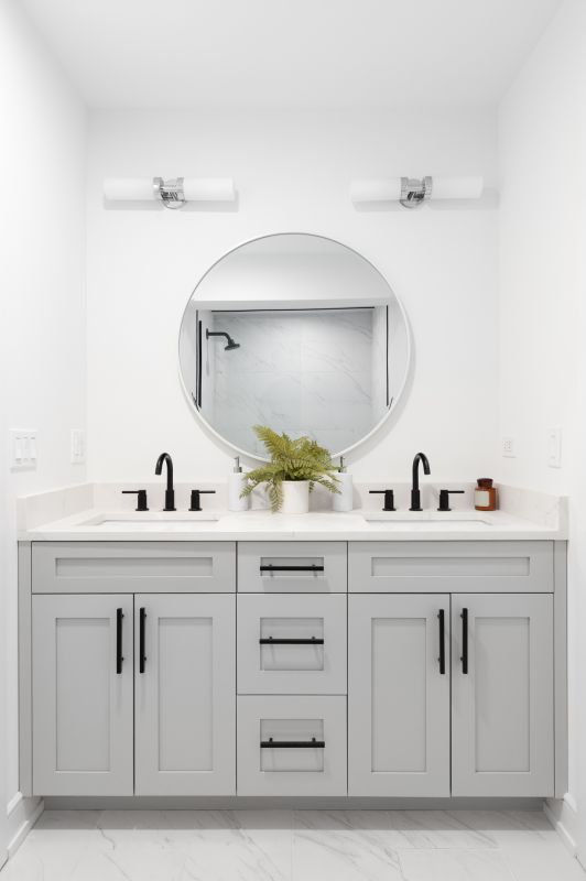 Backlit Mirror with Modern Fixtures